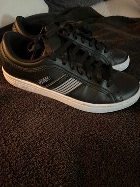 K-Swiss Big kids Black Leather Sneakers with White Sole.